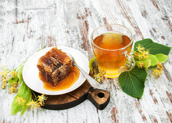 Honey comb, tea and linden flowers
