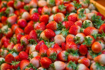 Fresh strawberries in the crate wood at the market Bangkok Thailand