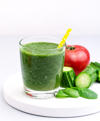 Fresh Tasty Spinach Tomatoes Cucumber Smoothie in Glasses Fresh Vgetables Detox Drink White Wooden Tray Gray Background Vertical