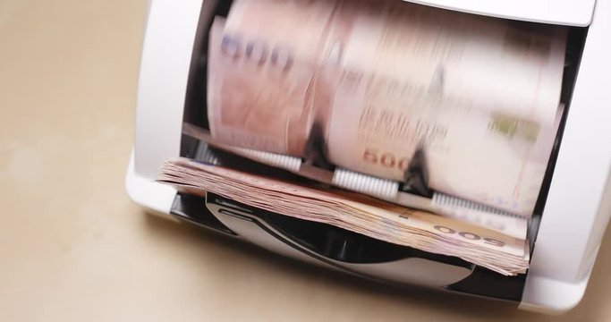 Money counter machine counting Hong Kong dollar