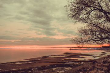 Fototapeta na wymiar beautiful sunset view over sea with stones