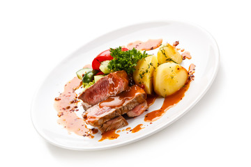 Fototapeta na wymiar Grilled steak with vegetables on white background 