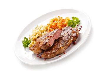 Grilled steak with vegetables on white background 