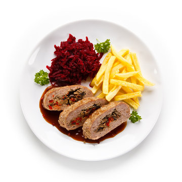 Stuffed meat, French fries and vegetables on white background 