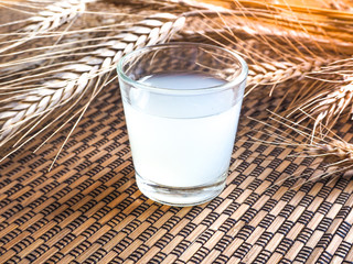 The glass of protein on a bamboo background. Vintage.