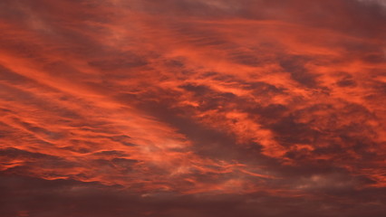 Red cloudy sky at sunrise.