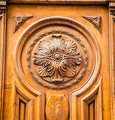 Fototapeta na wymiar ornate design on a wooden church door