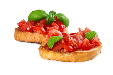 Two bruschetta with fresh tomato and basil