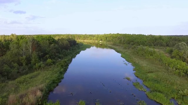 A flight over a beautiful river. Chernobyl. The river Uzh. Copter flying