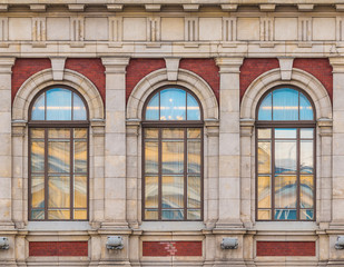 Obraz premium Three windows in a row on the facade of the urban historic building front view, Saint Petersburg, Russia 
