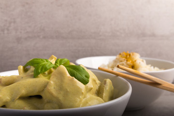 green cocos curry sous with chicken and rice