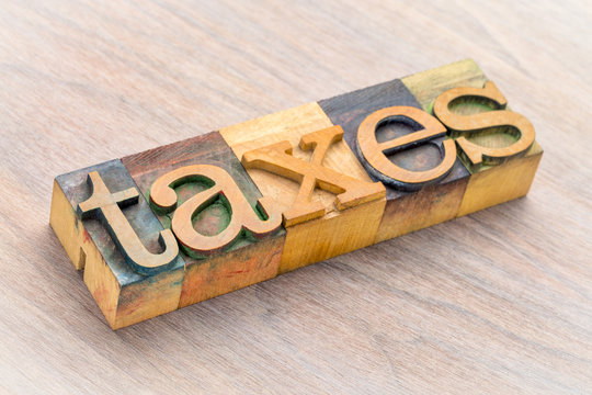 taxes word abstract in wood type