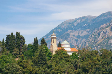 Church on a background of mountains.  Kamenari, Montenegro