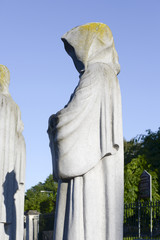 faceless monk statue outside church