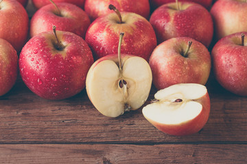 red apples on a wooden table