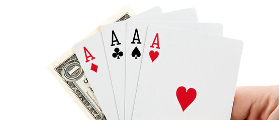 fan of playing card aces and a bill of the dollar in hand on a white background