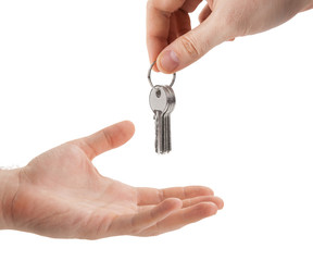 hands over the keys to the apartment from hand to hand