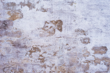 Ancient brick wall with remains of plaster - grunge background, texture