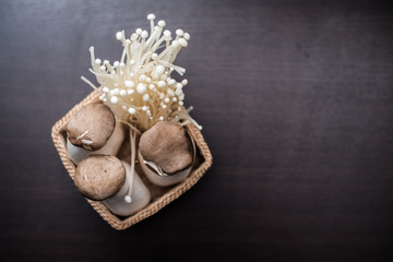 Obraz na płótnie Canvas Mushroom in The basket weave on wood background.
