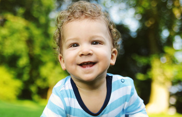 Cute little boy plays in the park

