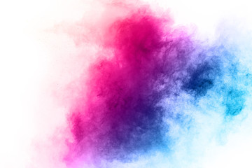 Colorful powder explosion on white background. Colored cloud. Colorful dust explode. Paint Holi.