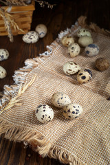 quail eggs on a napkin on a wooden table