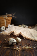 quail eggs on a napkin on a wooden table