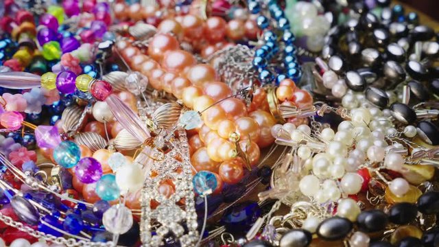 Heap of jewelry, beads, rings and bracelets