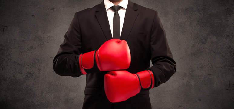Boxing businessman with red boxing gloves