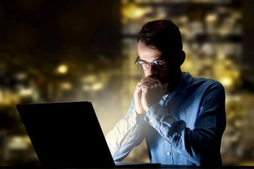 Businessman in the office at night