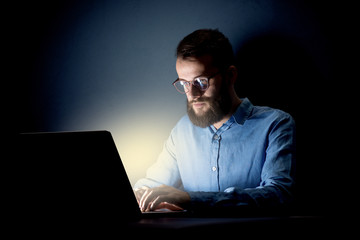 Businessman in the office at night