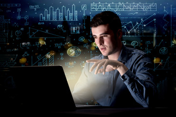 Businessman in the office at night