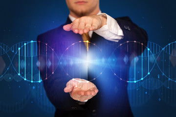 Businessman holding DNA