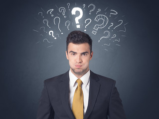 Businessman with question marks
