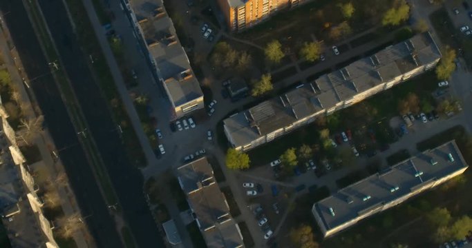 Fly over industrial cityscape. Aerial shot.  Zoom in Zoom out