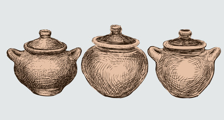 A set of three clay pots