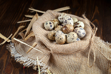 quail eggs on a napkin on a wooden table