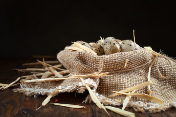quail eggs on a napkin on a wooden table
