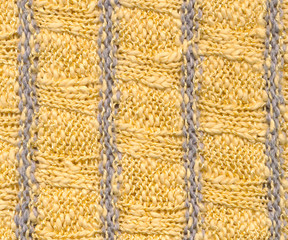 Background - knitted pattern in yellow and grey