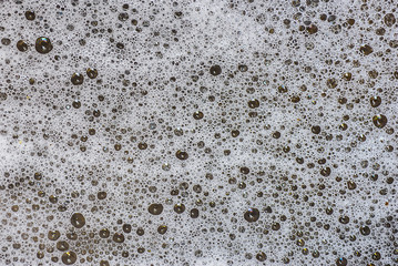 Patterns and surface bubbles of water.