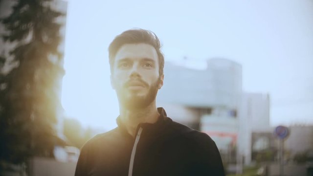 4K Concentrated European man preparing to start. Concept of concentration and focus. Bearded handsome positive male.