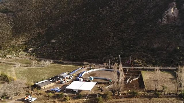 Aerial view of horse riding activity at mountain valley