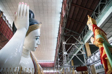 Kyauk Hhat Gyi the beautiful eyes and big reclining Buddha in Yangon township of Myanmar.