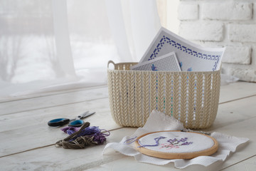 home organizers colored baskets with handmade accessories on whote table