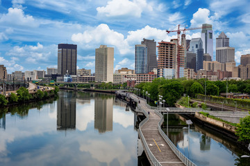 Fototapeta premium Philadelphia Pennsylvania skyline with walking path along river and clouds