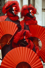 Venice Carnival figures dressed in comtumes and masks for the yearly festival