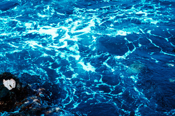 texture of sea water. Blue colour. foam in the sea