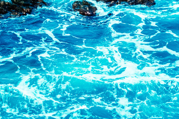 Fototapeta na wymiar texture and ocean water background. foam and waves