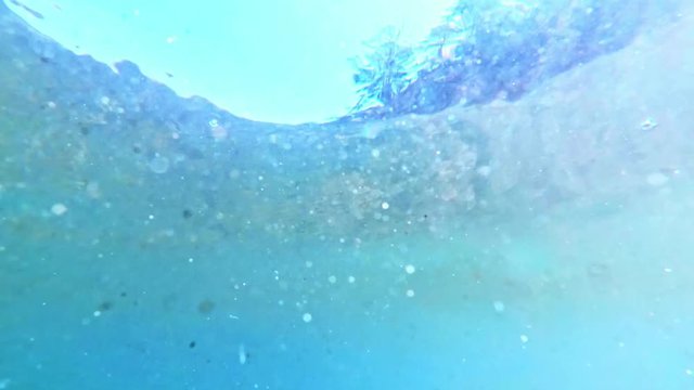 Underwater magic sand. Very nice fly particles of sand under water. The magic picture.