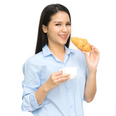 Asian woman holding in female hands croissant and drink hot aroma coffee or tea in breakfast time isolated on white background.